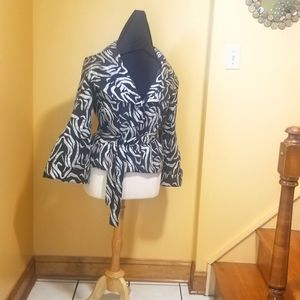 A pretty black and silver top.